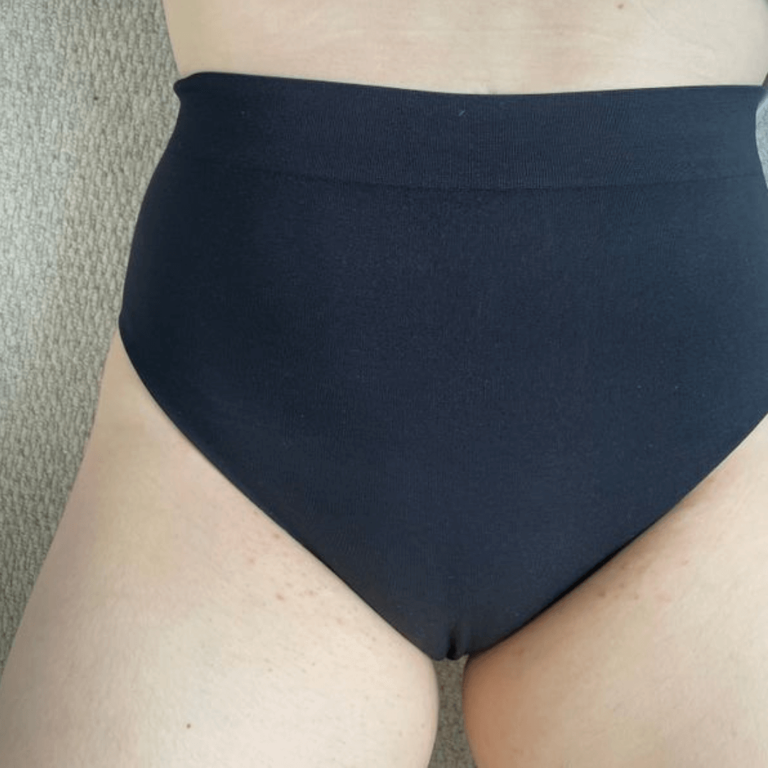 High-waisted black underwear designed for comfort and support, suitable for all skin types.